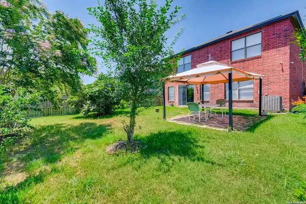 a view of a house with a yard porch and sitting area