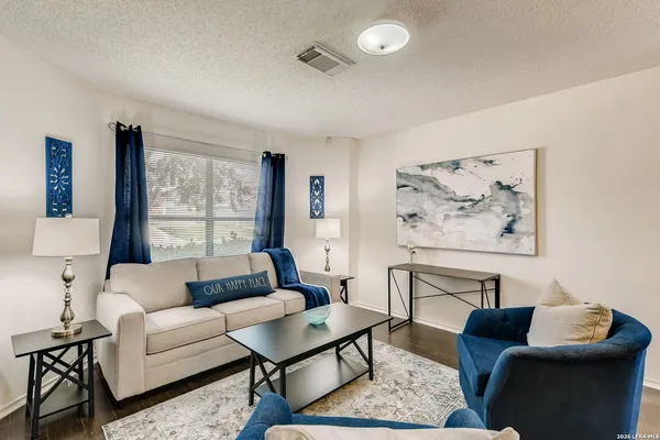 a living room with furniture and a window