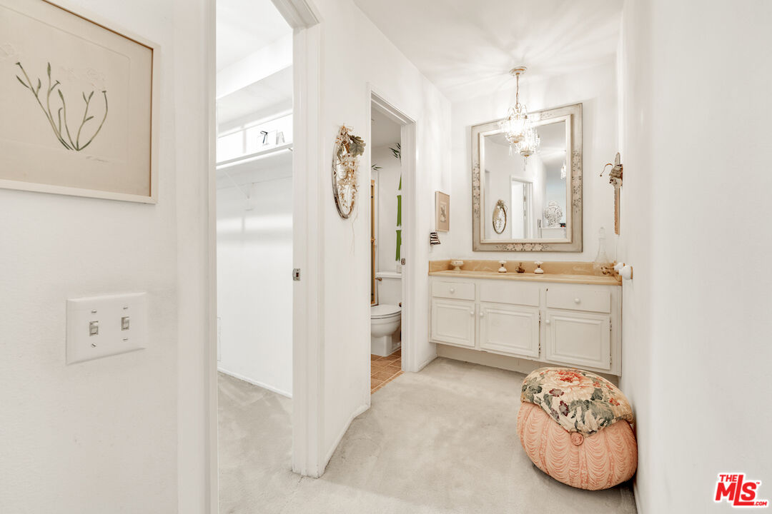 2385 Roscomare Road, Unit D17 Los Angeles, CA 90077 - Photo 13 of 22 a bathroom with a sink and a mirror