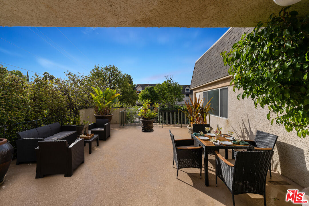 2385 Roscomare Road, Unit D17 Los Angeles, CA 90077 - Photo 17 of 22 an outdoor sitting area with furniture