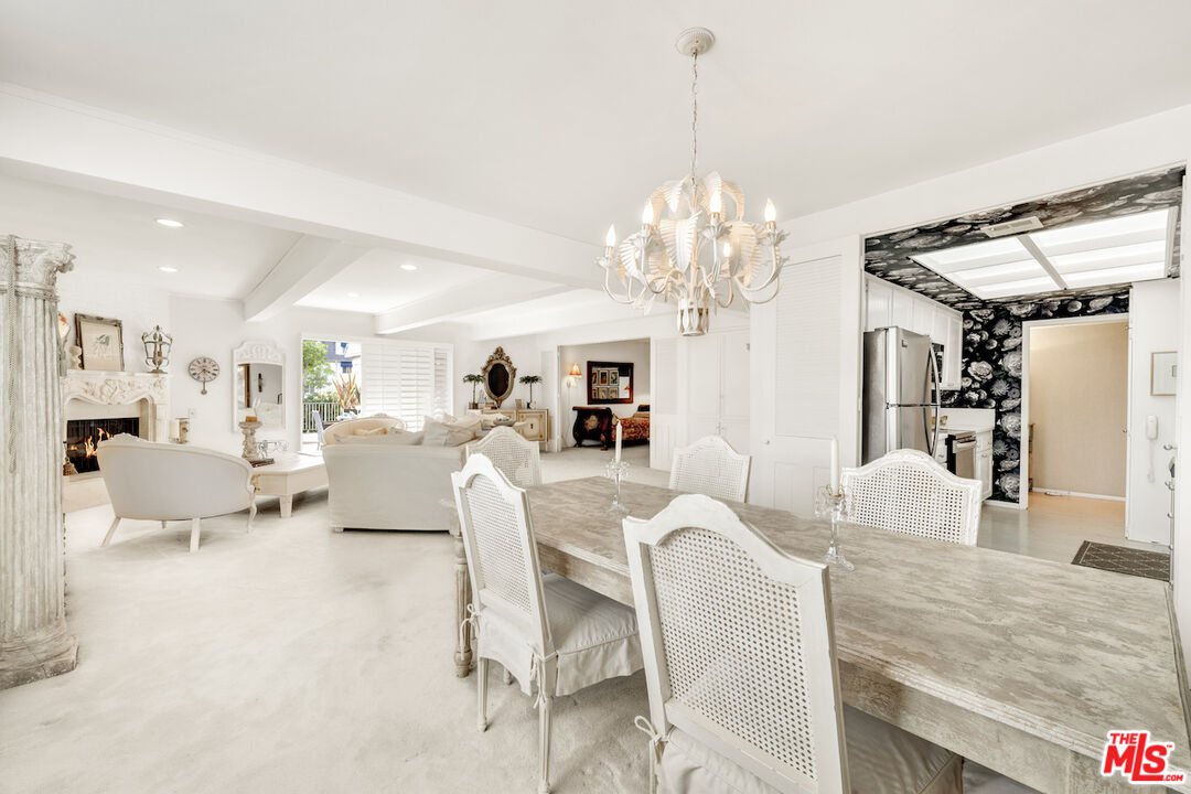 2385 Roscomare Road, Unit D17 Los Angeles, CA 90077 - Photo 6 of 22 a living room with furniture chandelier and a chandelier