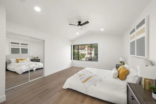 a bedroom with furniture and a window