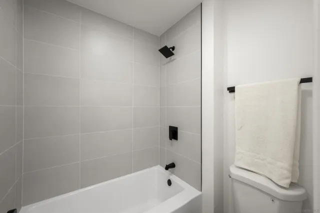 a bathroom with a bathtub and a shower