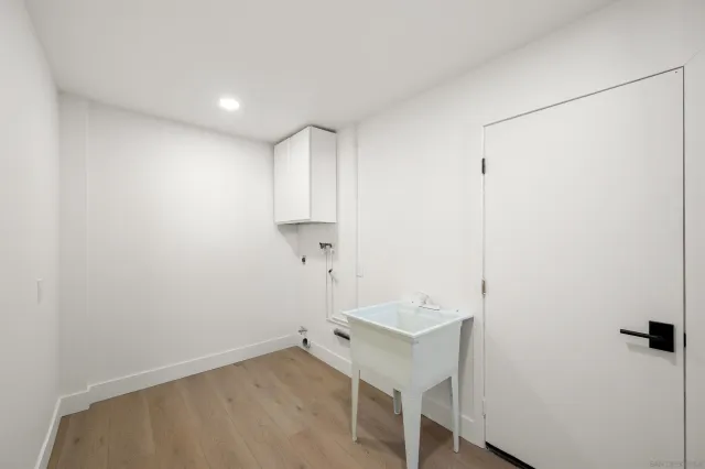 a view of a room with table and chairs