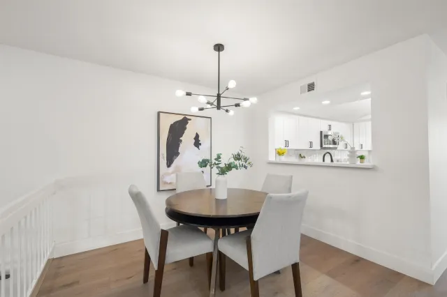 a dining room with furniture and chandelier