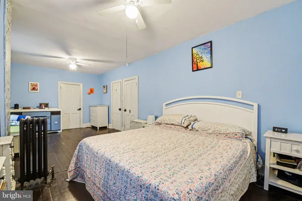 a bedroom with furniture and a window