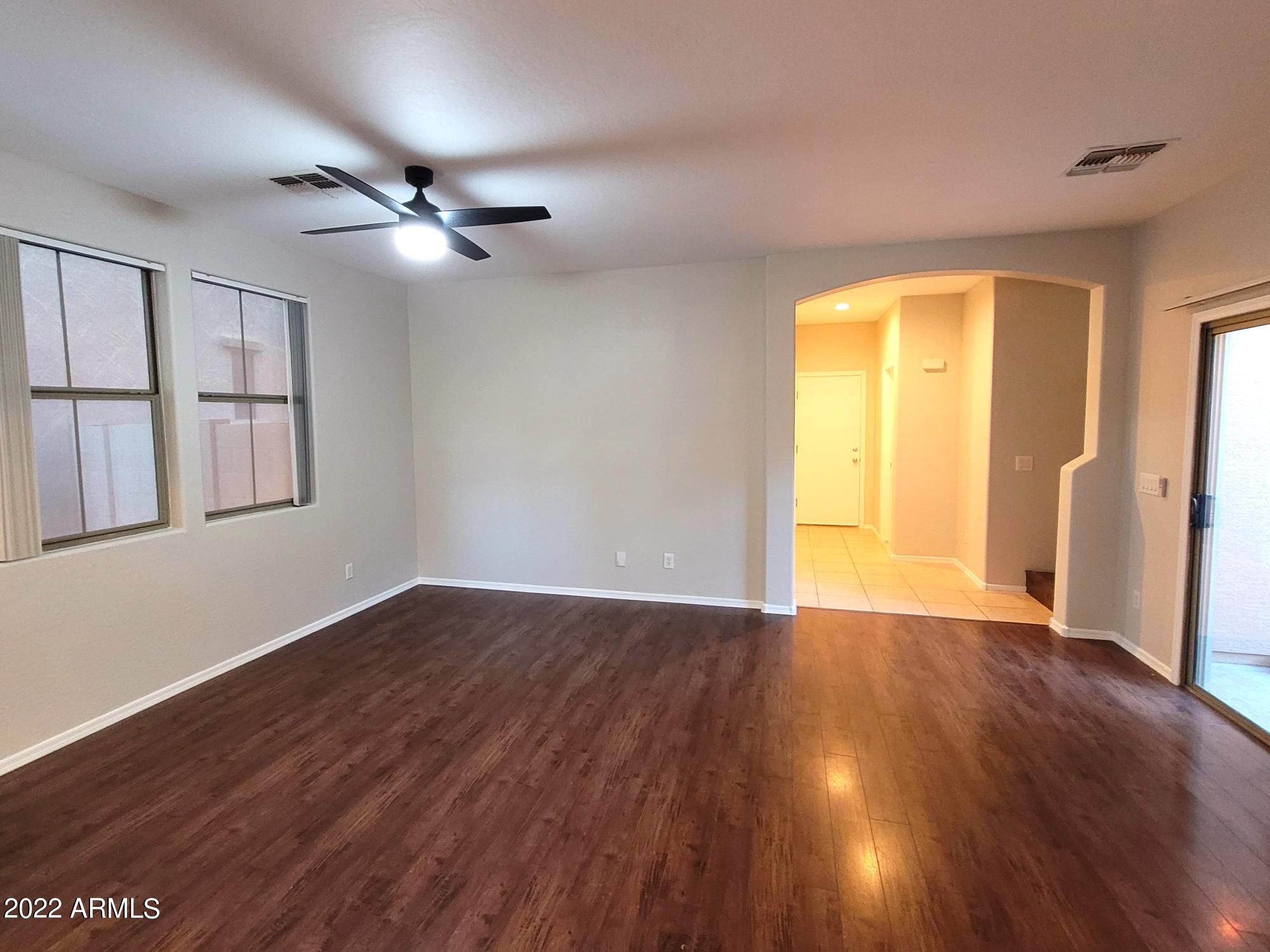 1930 East Harrison Street Gilbert, AZ 85295 - Photo 2 of 31 a view of an empty room with wooden floor and a window