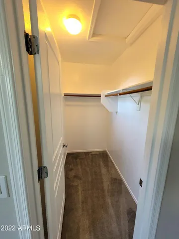 a view of a room with wooden door