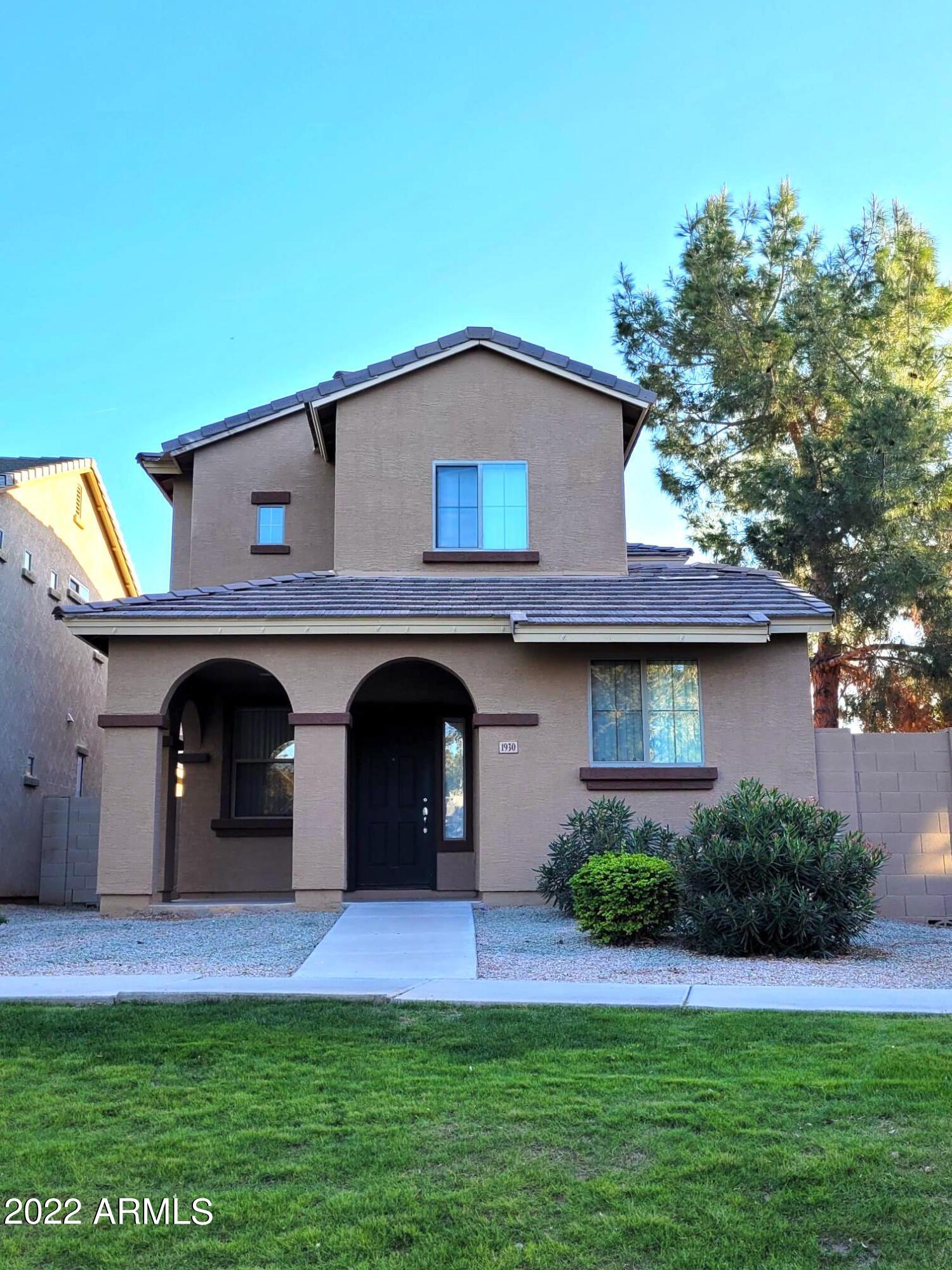 1930 East Harrison Street Gilbert, AZ 85295 - Photo 24 of 31 a view of a house with a yard and a fireplace
