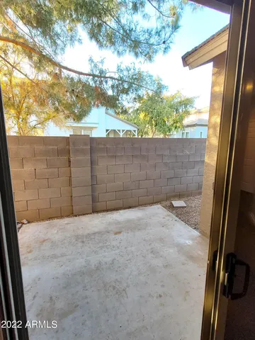 a view of a backyard of the house