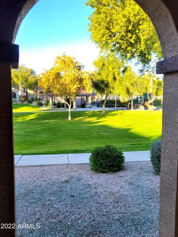 a view of a golf course with a big yard