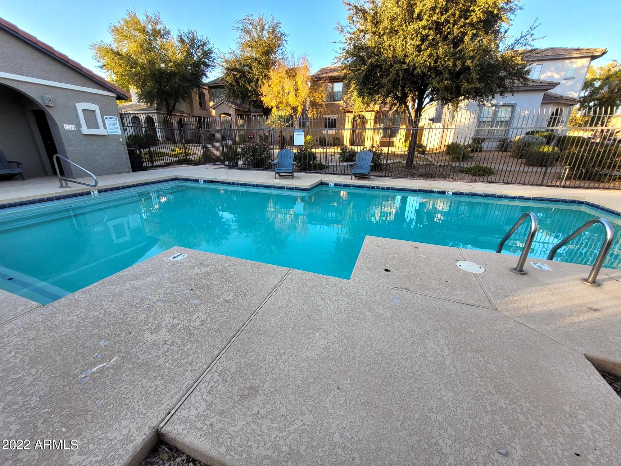 1930 East Harrison Street Gilbert, AZ 85295 - Photo 29 of 31 a house view with a swimming pool and a yard