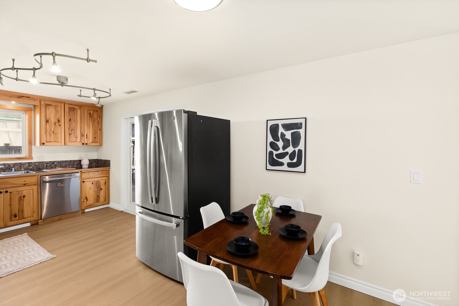 506 Train Street Southeast Orting, WA 98360 - Photo 13 of 24 a kitchen with stainless steel appliances granite countertop a refrigerator and a stove