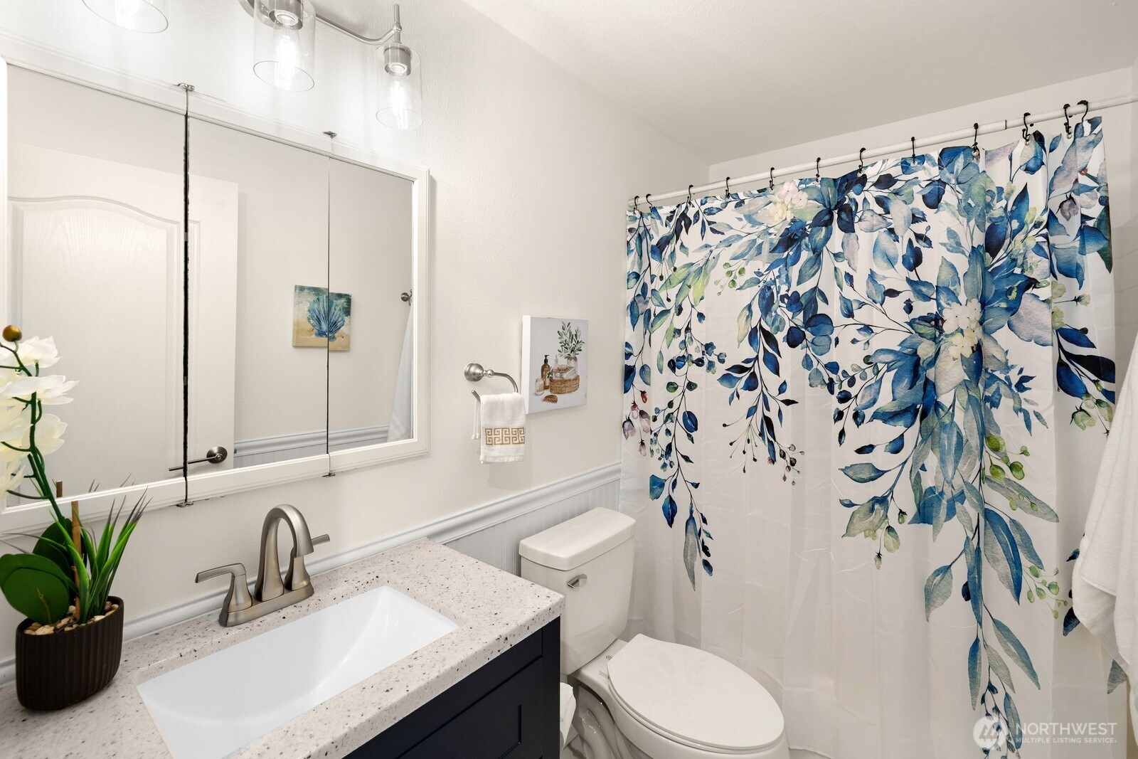 506 Train Street Southeast Orting, WA 98360 - Photo 16 of 24 a bathroom with a sink toilet and shower