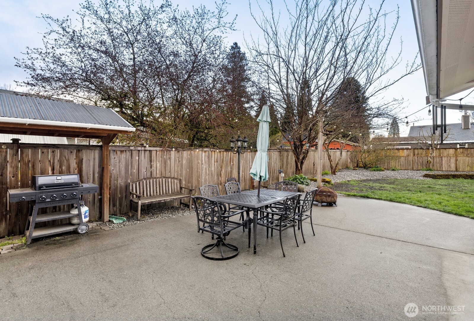506 Train Street Southeast Orting, WA 98360 - Photo 18 of 24 a view of a chairs and tables in the back yard of the house
