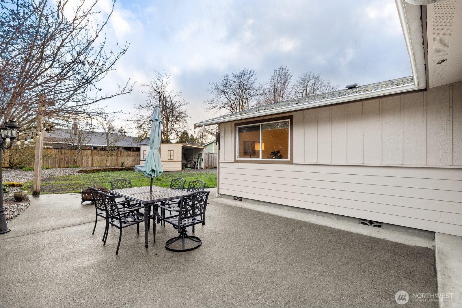 506 Train Street Southeast Orting, WA 98360 - Photo 19 of 24 a patio with table and chairs and potted plants