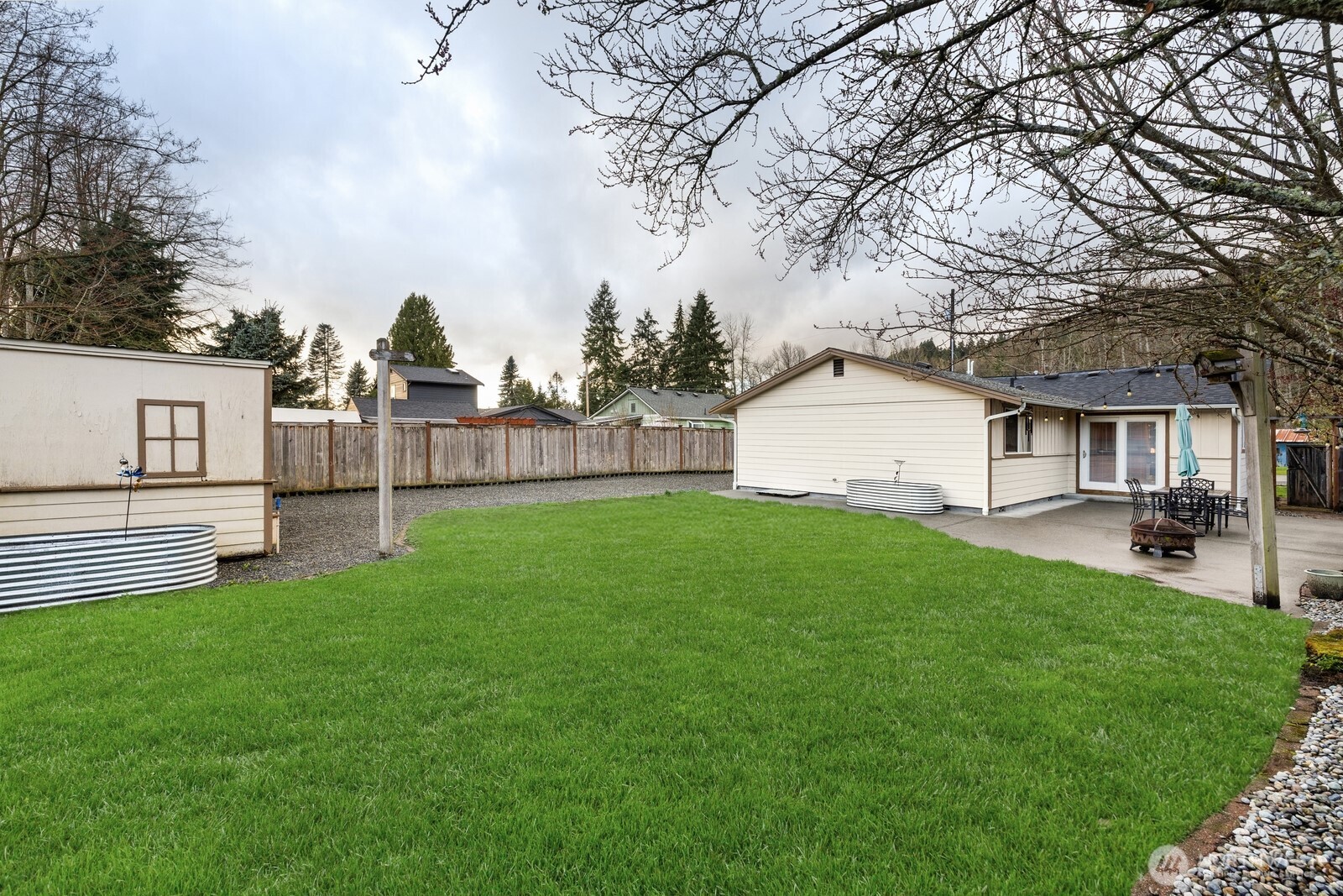 506 Train Street Southeast Orting, WA 98360 - Photo 20 of 24 a view of house with backyard