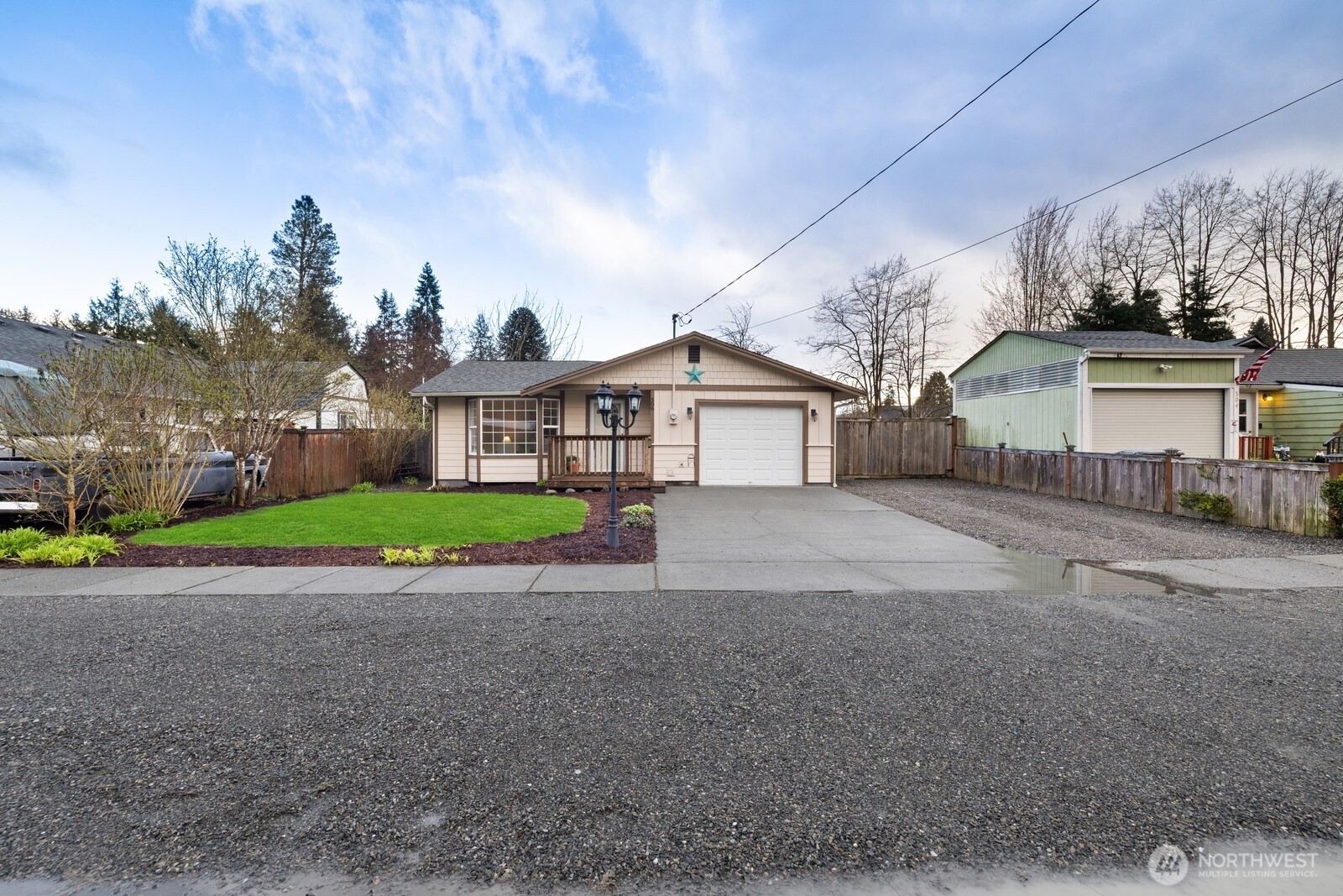 506 Train Street Southeast Orting, WA 98360 - Photo 2 of 24 a front view of house with yard and green space
