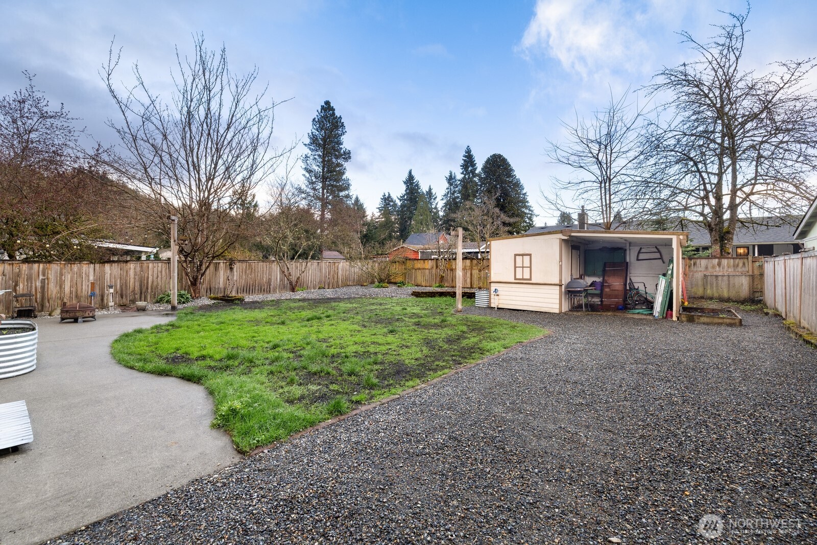 506 Train Street Southeast Orting, WA 98360 - Photo 23 of 24 a view of a house with backyard and trees