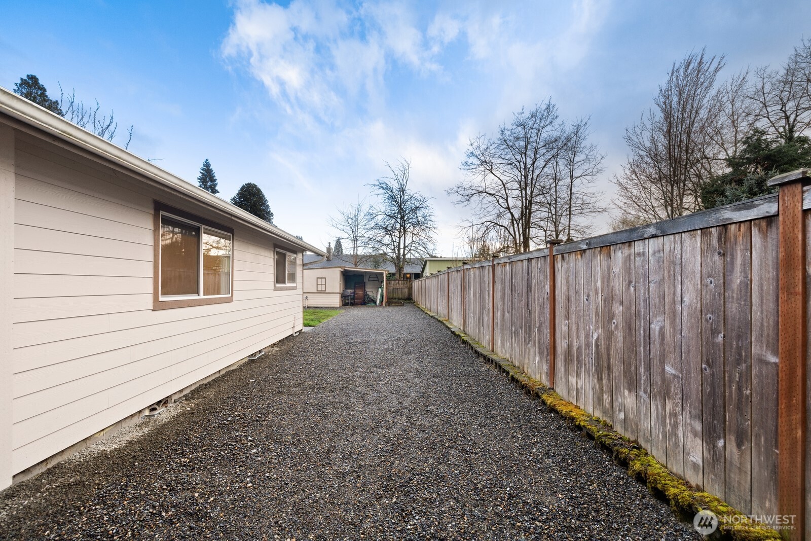 506 Train Street Southeast Orting, WA 98360 - Photo 24 of 24 a view of a backyard with wooden fence
