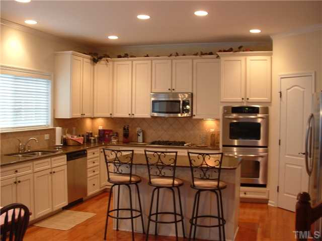 1908 Grace Point Road Morrisville, NC 27560 - Photo 5 of 22 This spacious kitchen boasts a Gas Cooktop Range; Vented mounted Microwave; Double Ovens and extra deep Sinks w/disposal; Stainless DW and Refrigerator. There is a wonderful Island with pull out drawers in the cabinets and a huge Pantry! Ctrtps are Zodiac Kitchen