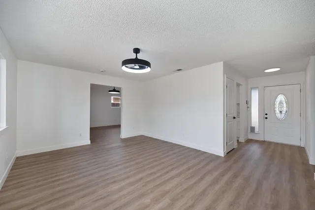 a view of an empty room with a window