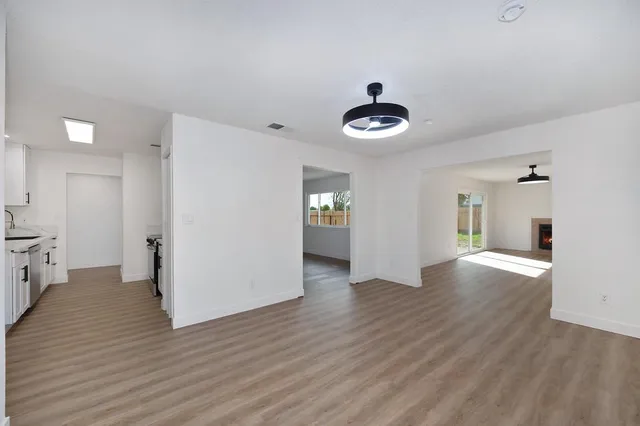 a kitchen with stainless steel appliances a sink stove and cabinets