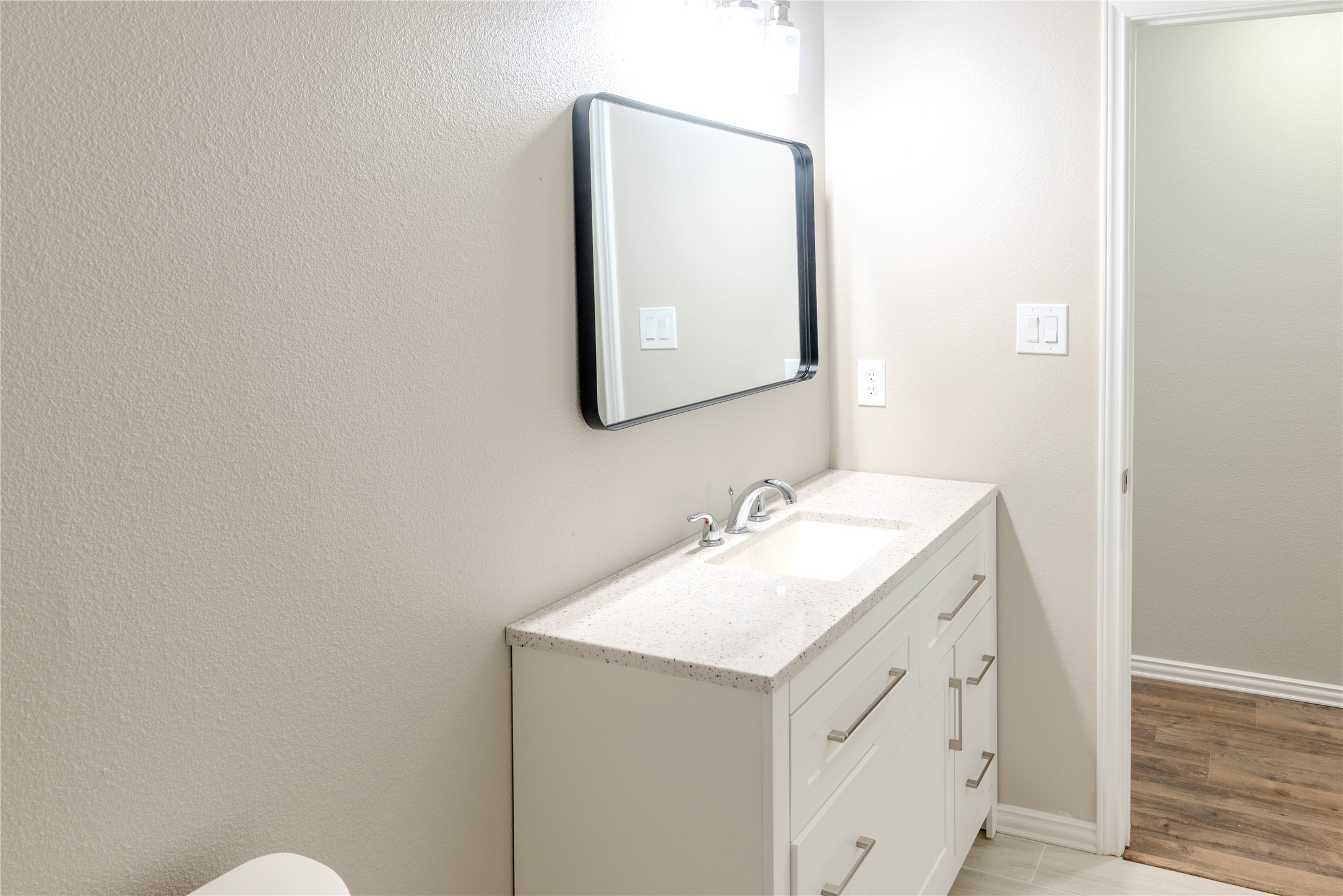 729 Planters Street Emory, TX 75440 - Photo 14 of 22 a bathroom with a sink and a mirror