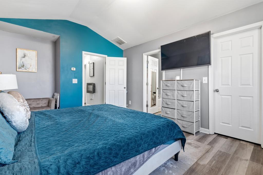 5914 Waggoner Court Rex, GA 30273 - Photo 15 of 21 a bedroom with a bed and a flat screen tv