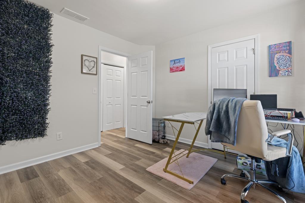 5914 Waggoner Court Rex, GA 30273 - Photo 18 of 21 a view of a workspace with furniture and wooden floor