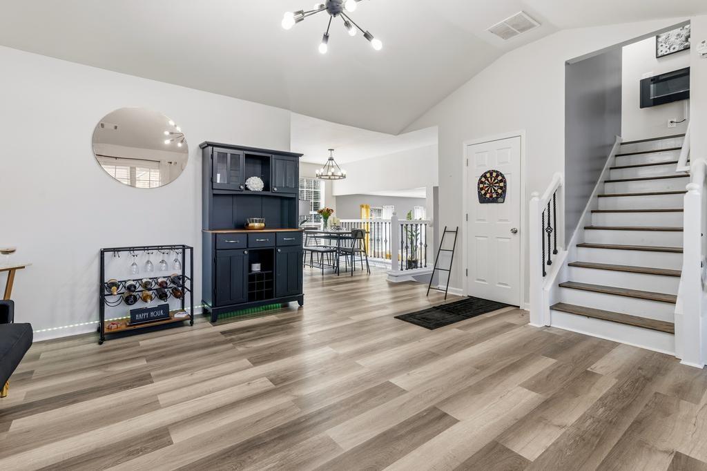 5914 Waggoner Court Rex, GA 30273 - Photo 6 of 21 a view of a livingroom with hardwood floor and a ceiling fan