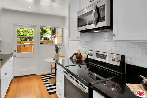 a kitchen with a stove and a microwave