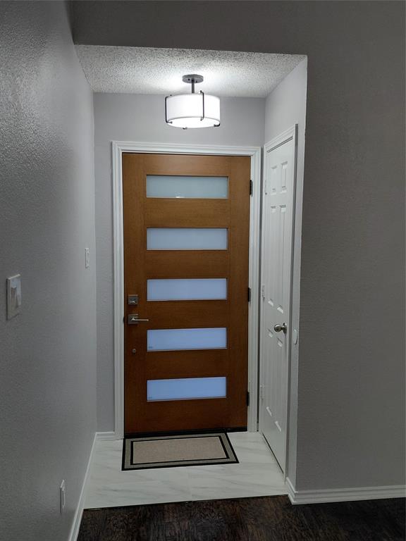 626 Albrook Drive Allen, TX 75002 - Photo 2 of 32 Inside New Front Door, New Light Fixture & Beautiful New Entry Flooring