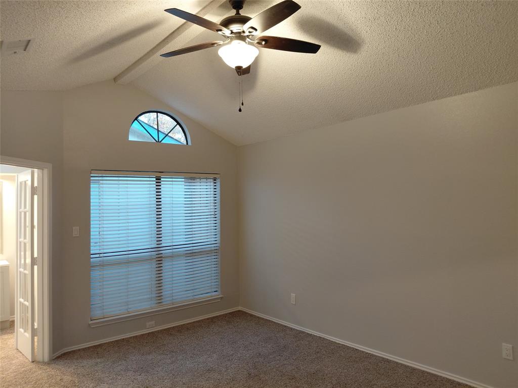 626 Albrook Drive Allen, TX 75002 - Photo 25 of 32 Primary Bedroom with Window to Atrium Area & Entrance to Primary Bath