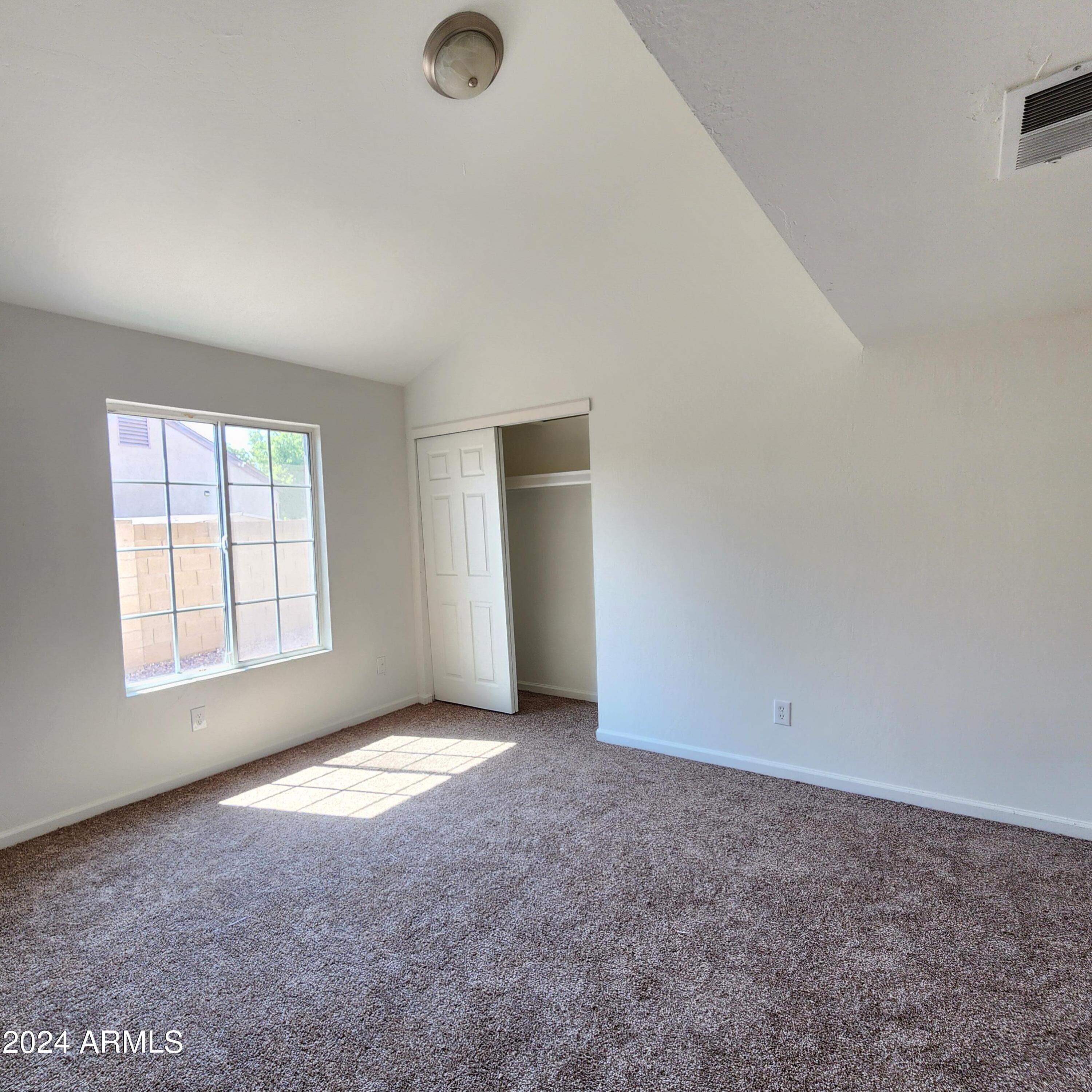 3017 West Yucca Street Phoenix, AZ 85029 - Photo 22 of 32 an empty room with windows