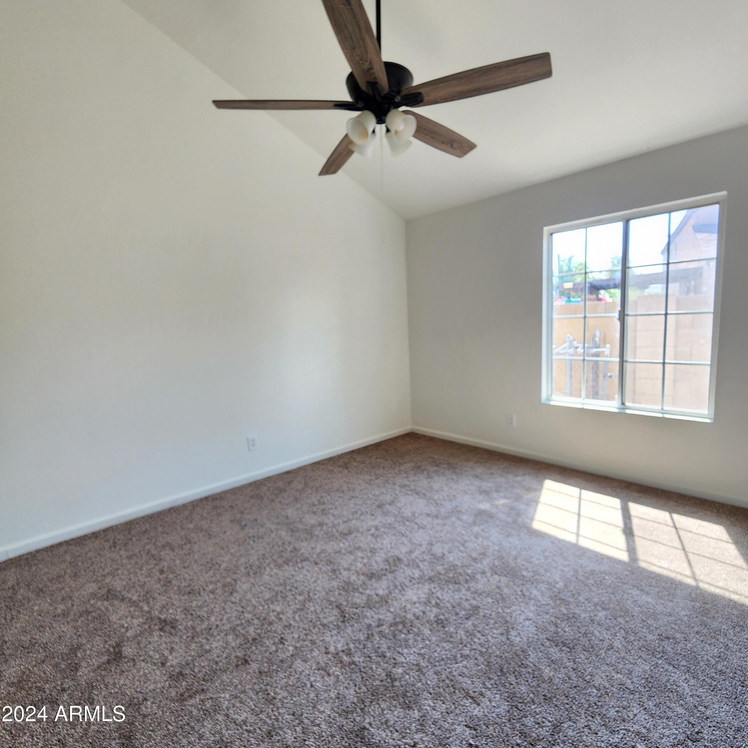 3017 West Yucca Street Phoenix, AZ 85029 - Photo 23 of 32 a view of an empty room with a window