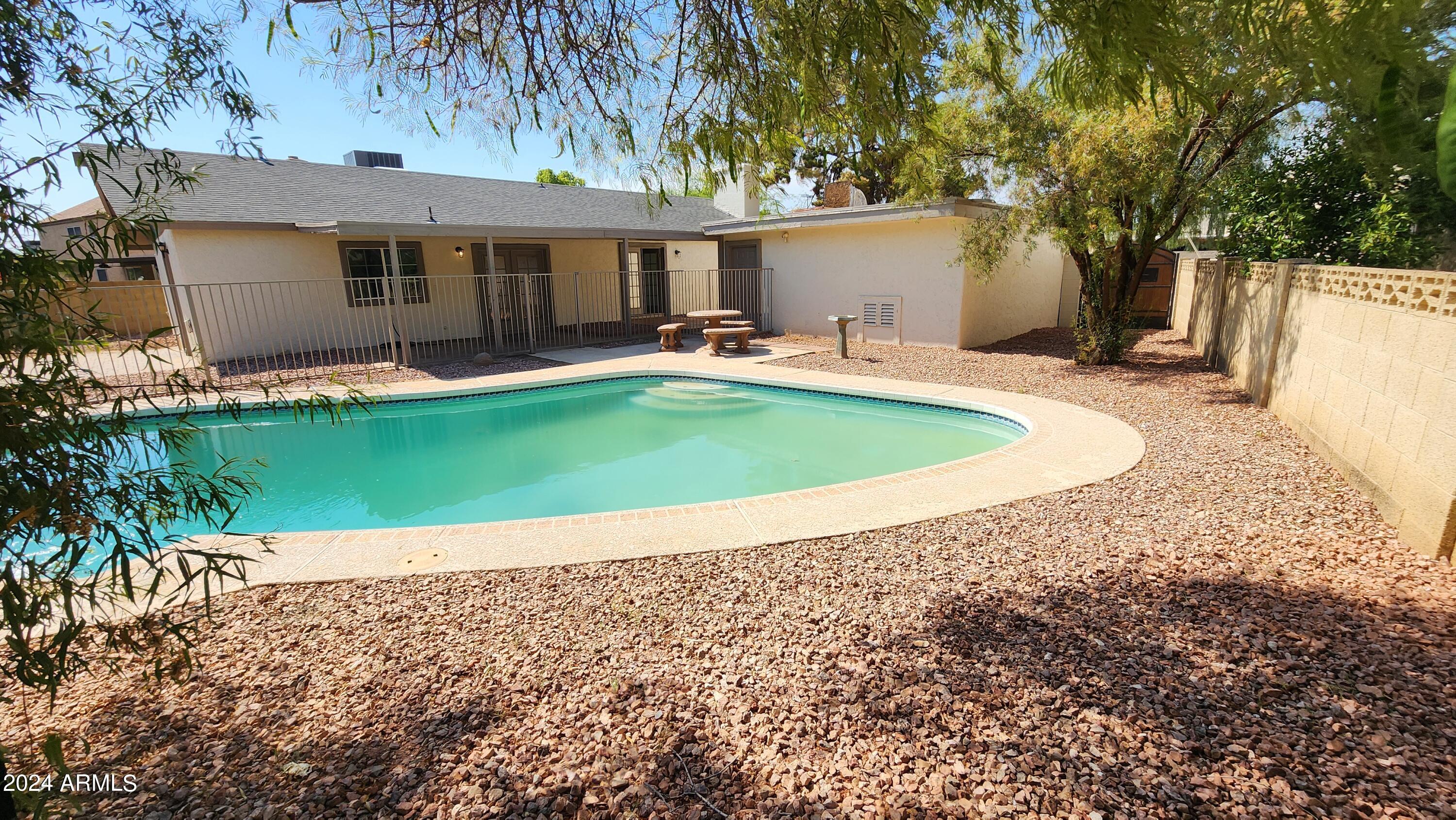 3017 West Yucca Street Phoenix, AZ 85029 - Photo 29 of 32 a view of a house with backyard and sitting area