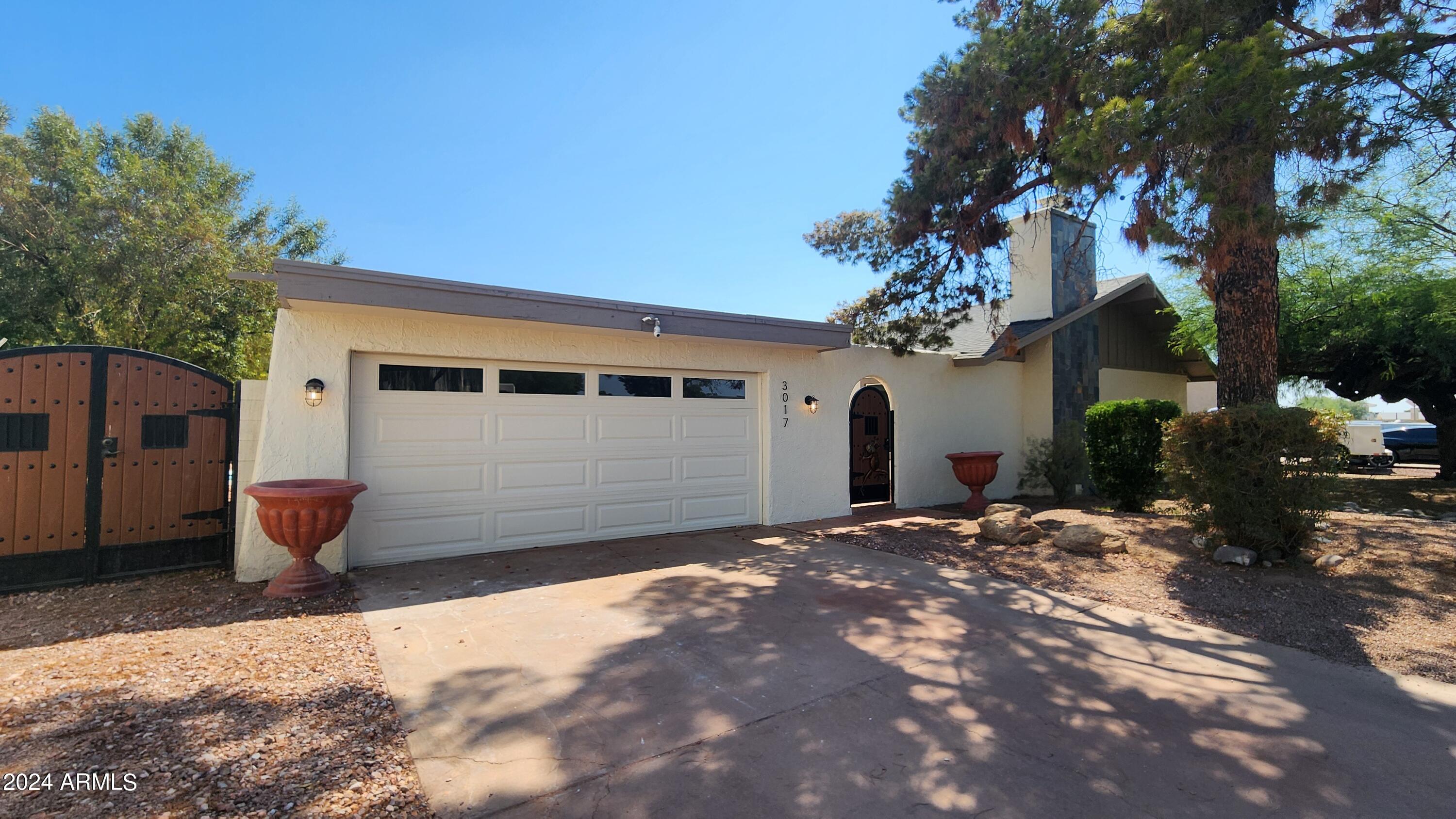 3017 West Yucca Street Phoenix, AZ 85029 - Photo 3 of 32 a backyard of a house with yard and outdoor seating