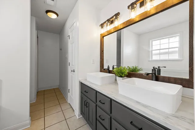 a bathroom with a sink and a mirror