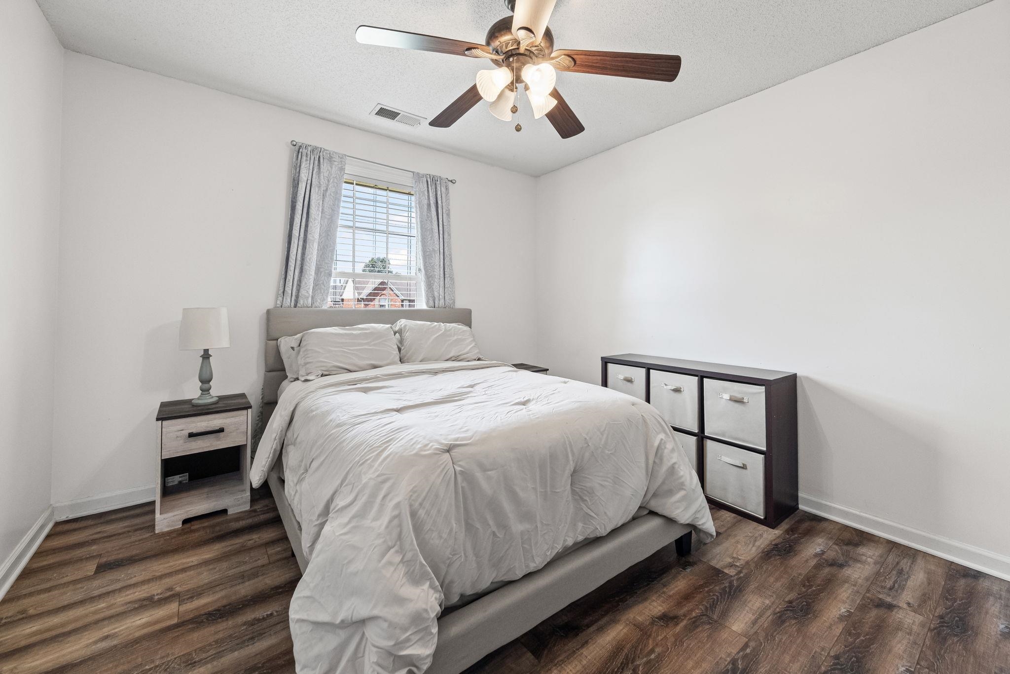 256 Azalea Drive Atoka, TN 38004 - Photo 27 of 39 Bedroom with dark wood finished floors and a ceiling fan