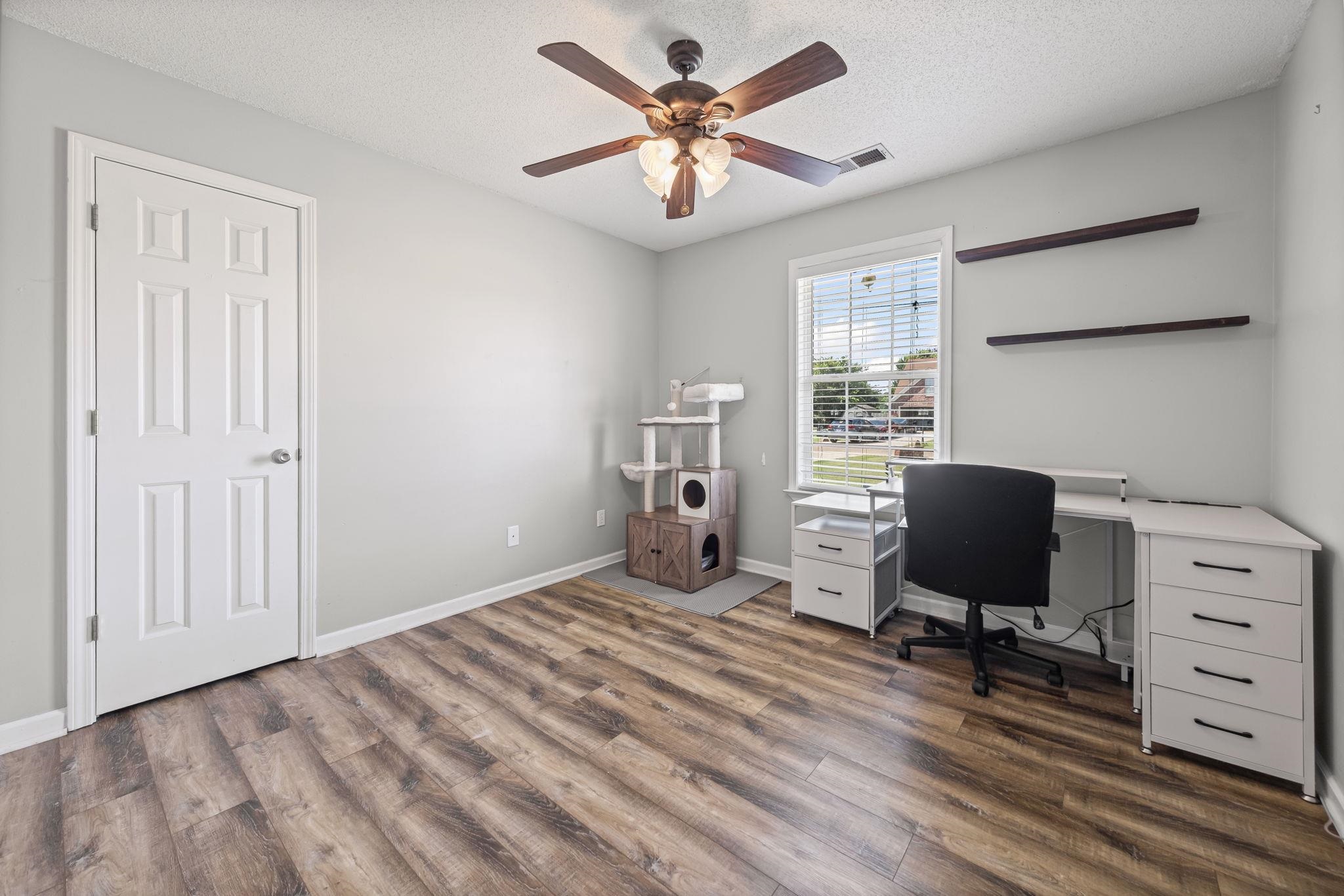 256 Azalea Drive Atoka, TN 38004 - Photo 29 of 39 Office space with dark wood finished floors, a ceiling fan, and a textured ceiling