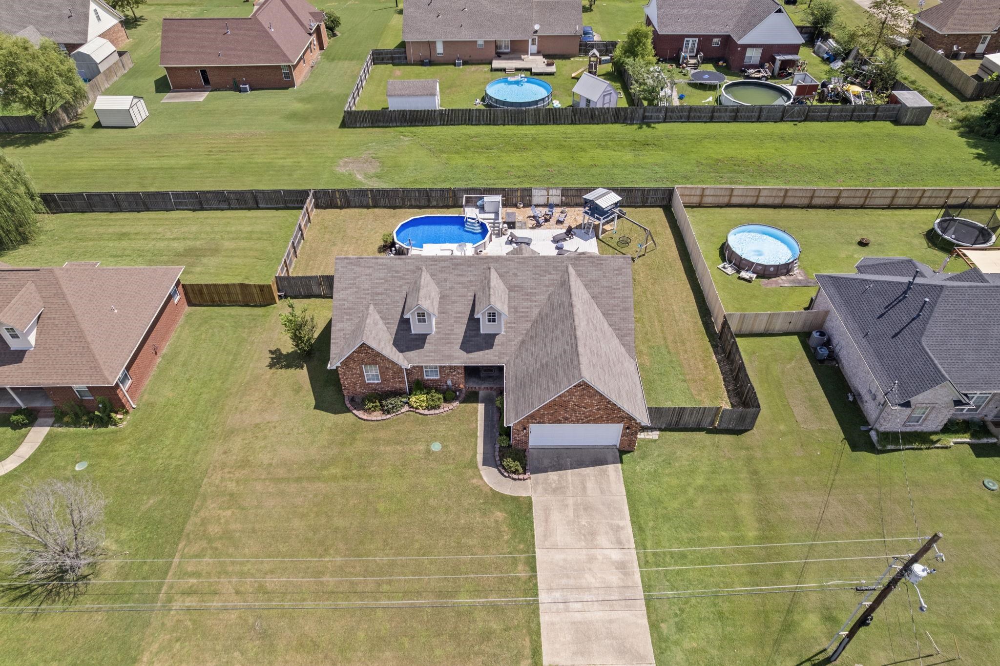 256 Azalea Drive Atoka, TN 38004 - Photo 3 of 39 Aerial view of residential area with a pool area