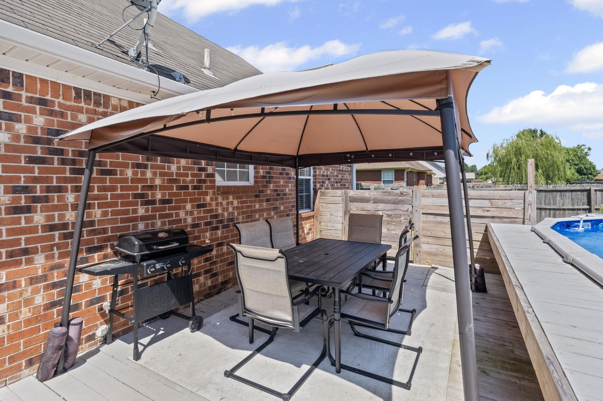 256 Azalea Drive Atoka, TN 38004 - Photo 32 of 39 View of patio / terrace with a gazebo, grilling area, and outdoor dining space