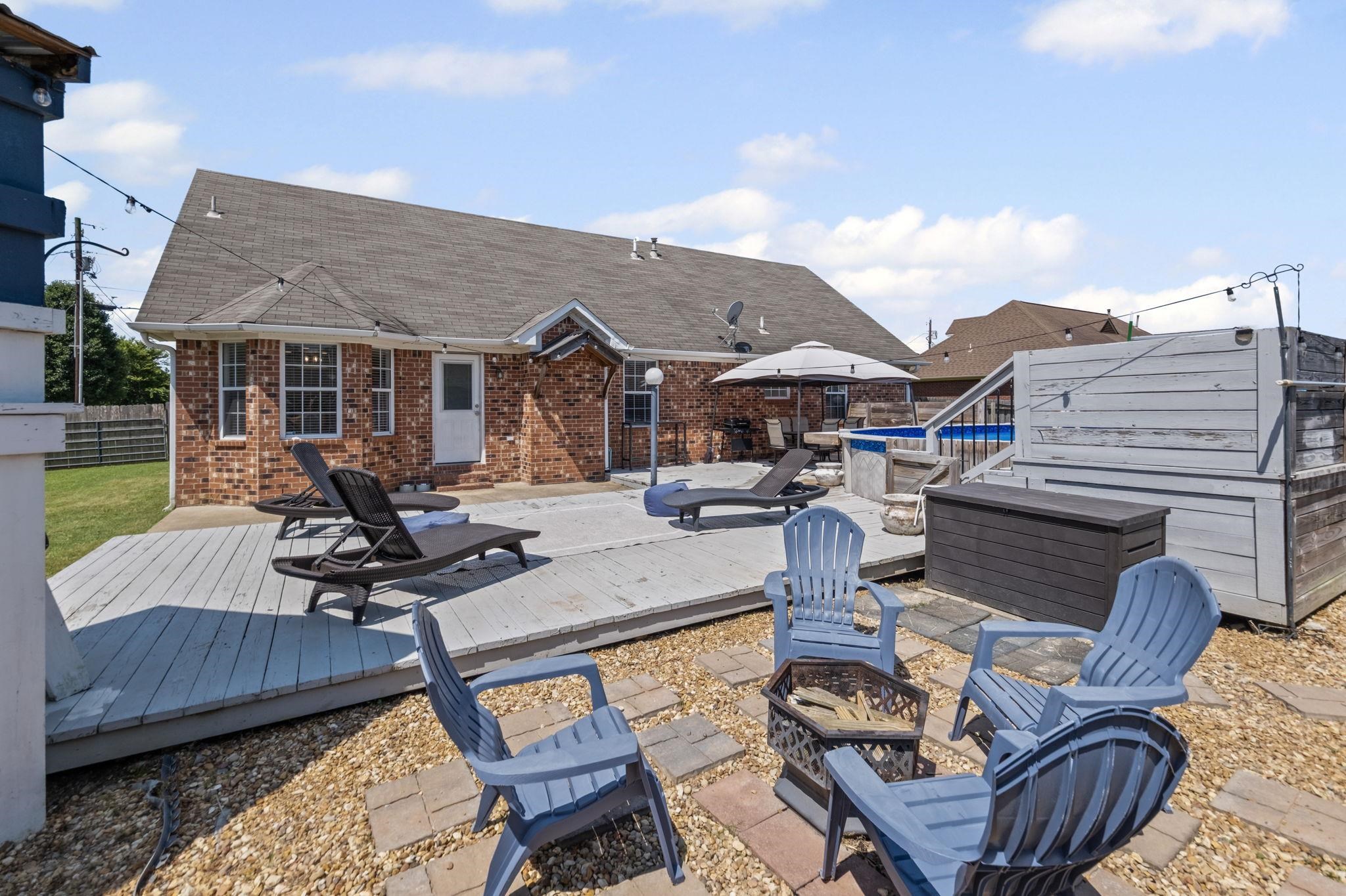 256 Azalea Drive Atoka, TN 38004 - Photo 34 of 39 View of patio featuring an outdoor fire pit and a wooden deck