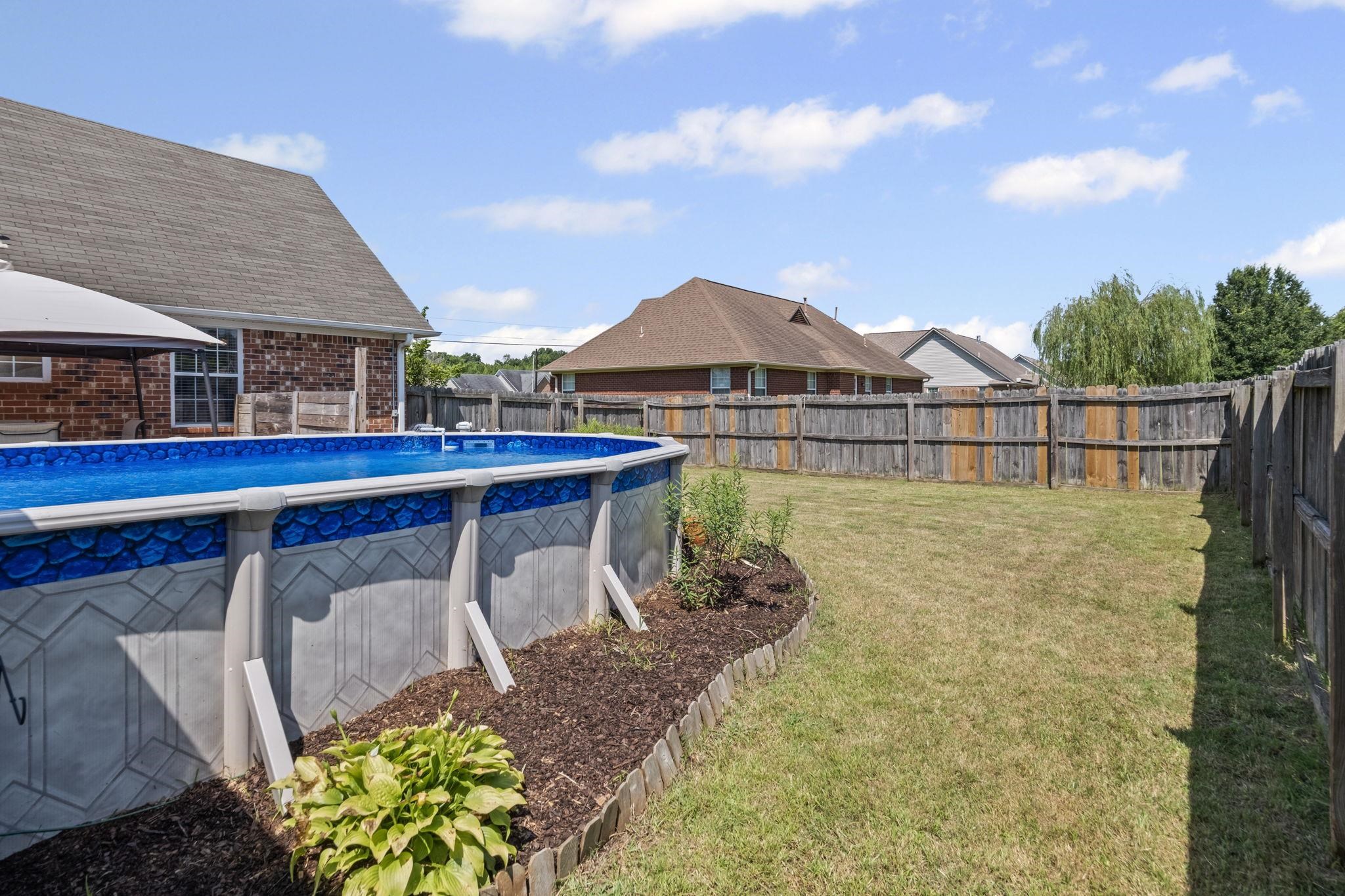 256 Azalea Drive Atoka, TN 38004 - Photo 35 of 39 View of pool with a fenced backyard