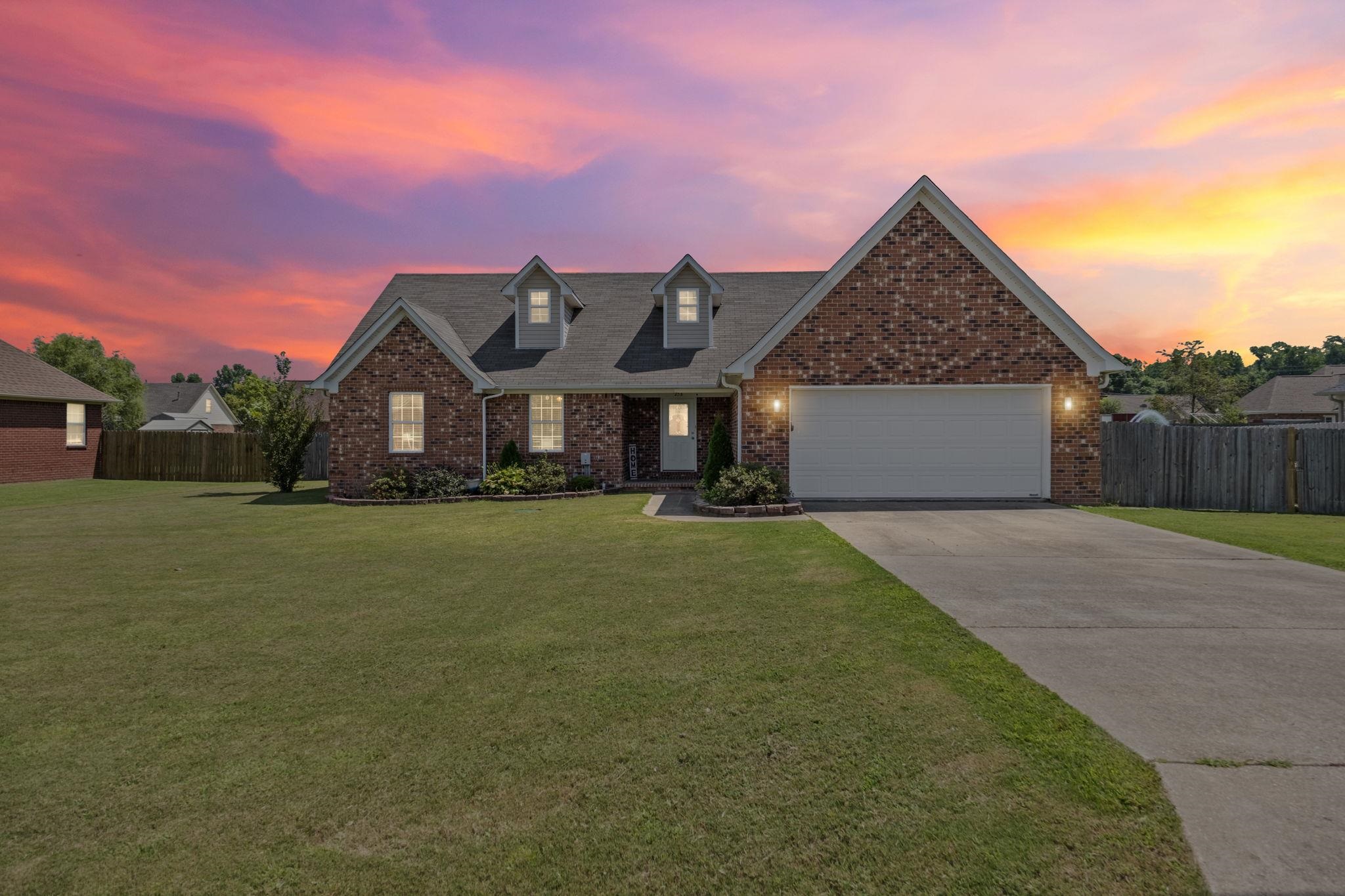 256 Azalea Drive Atoka, TN 38004 - Photo 38 of 39 View of front of home featuring concrete driveway, a garage, and brick siding