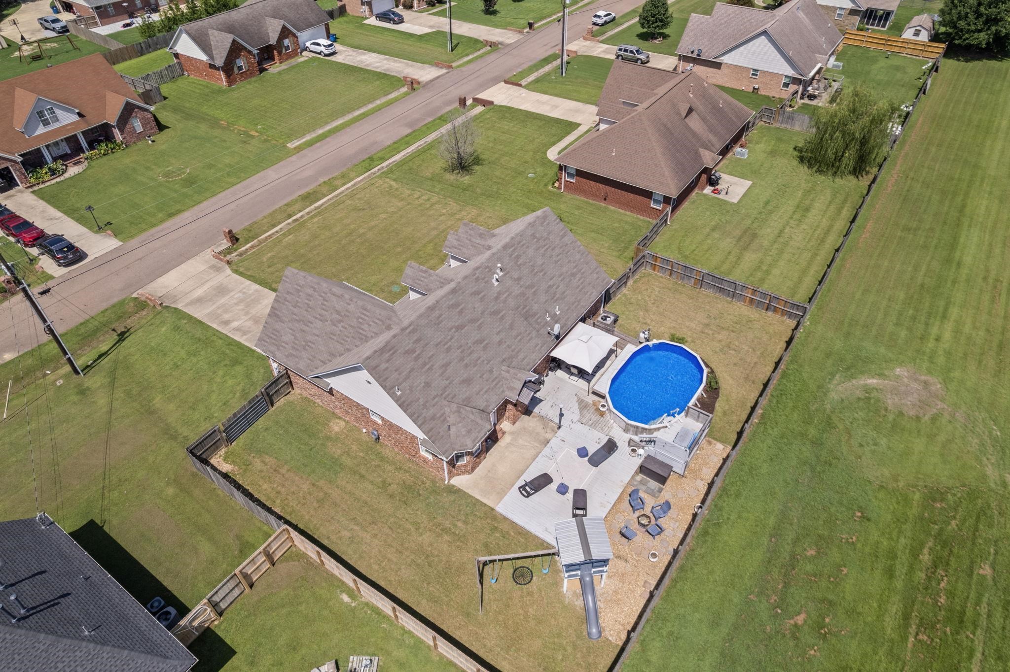 256 Azalea Drive Atoka, TN 38004 - Photo 5 of 39 Aerial perspective of suburban area with a pool area