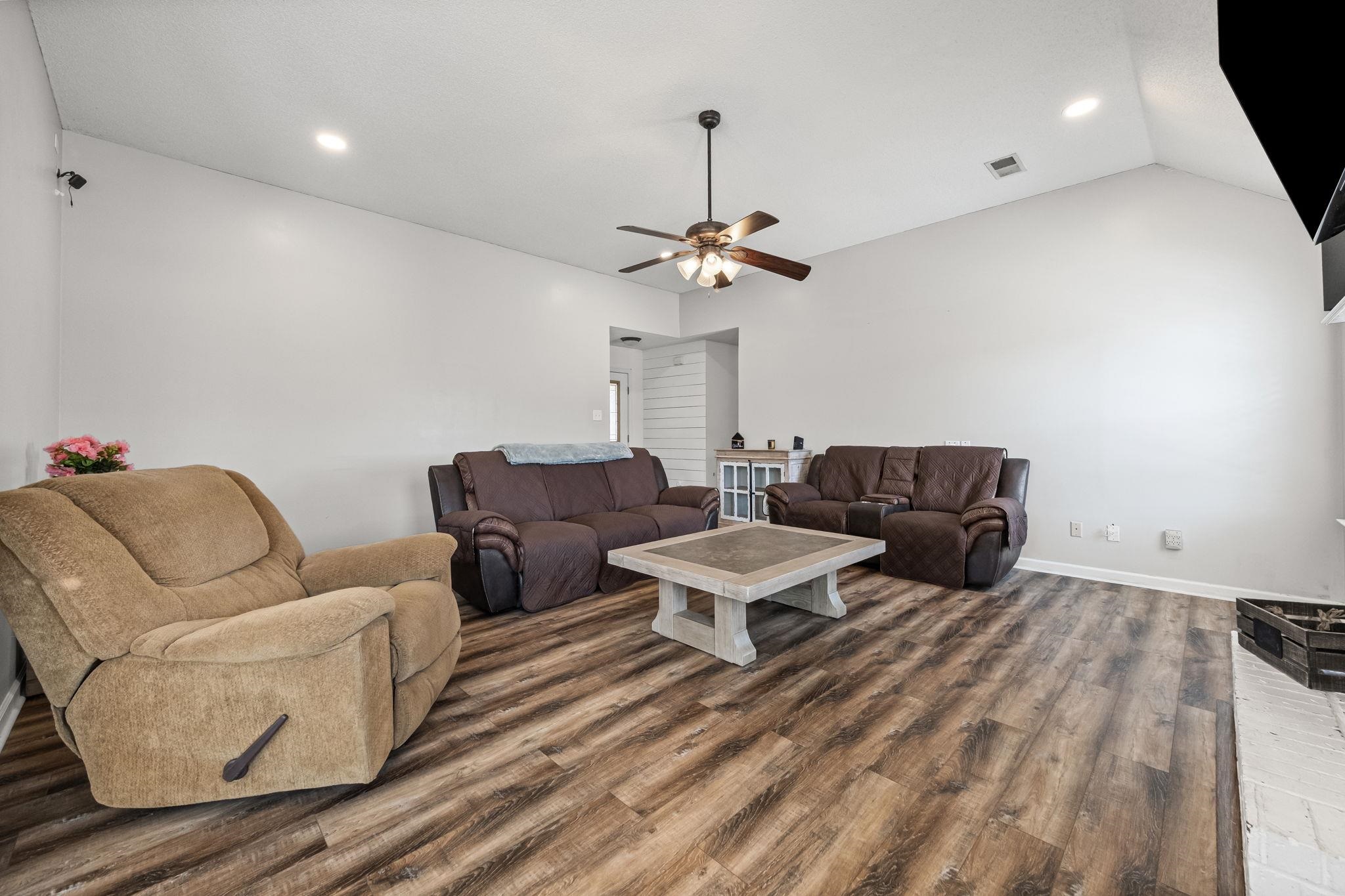 256 Azalea Drive Atoka, TN 38004 - Photo 9 of 39 Living room featuring wood finished floors, a ceiling fan, lofted ceiling, and recessed lighting