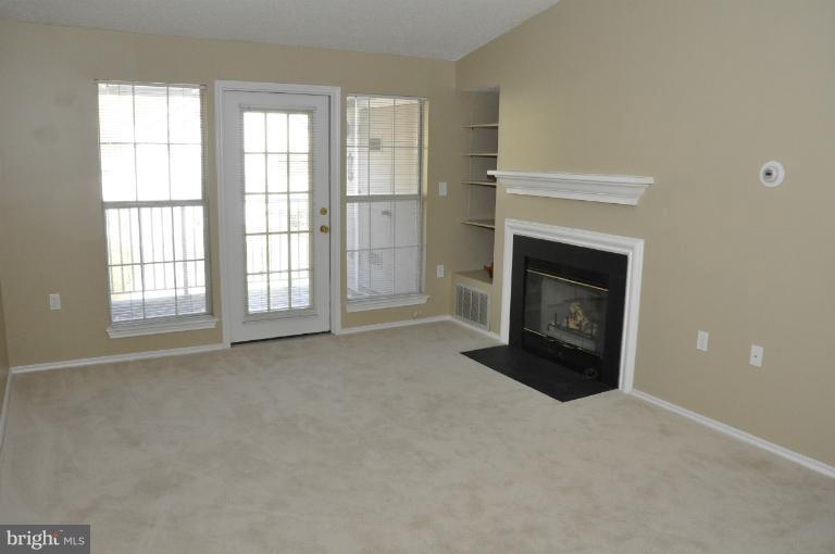 21029 Timber Ridge Terrace, Unit 304 Ashburn, VA 20147 - Photo 3 of 20 Family Room Features Vaulted Ceiling, New Carpet