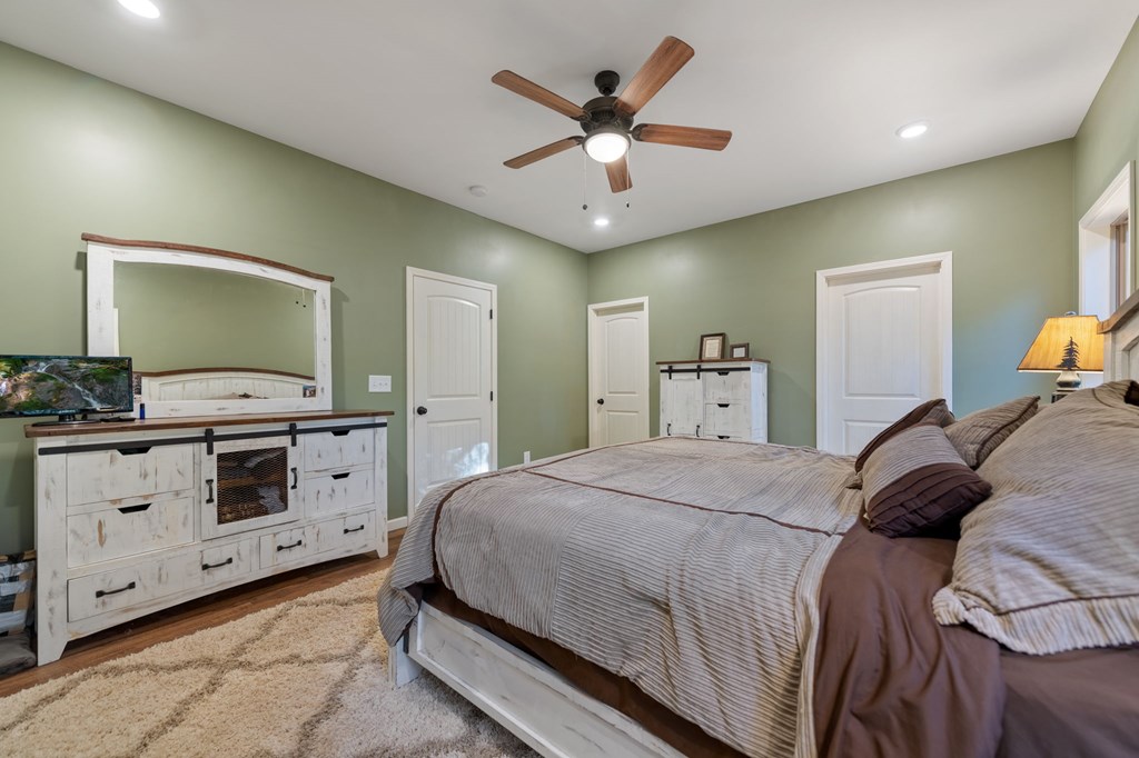 44 Lower Toccoa Hills Road Blue Ridge, GA 30513 - Photo 12 of 36 a bedroom with a bed and a dresser